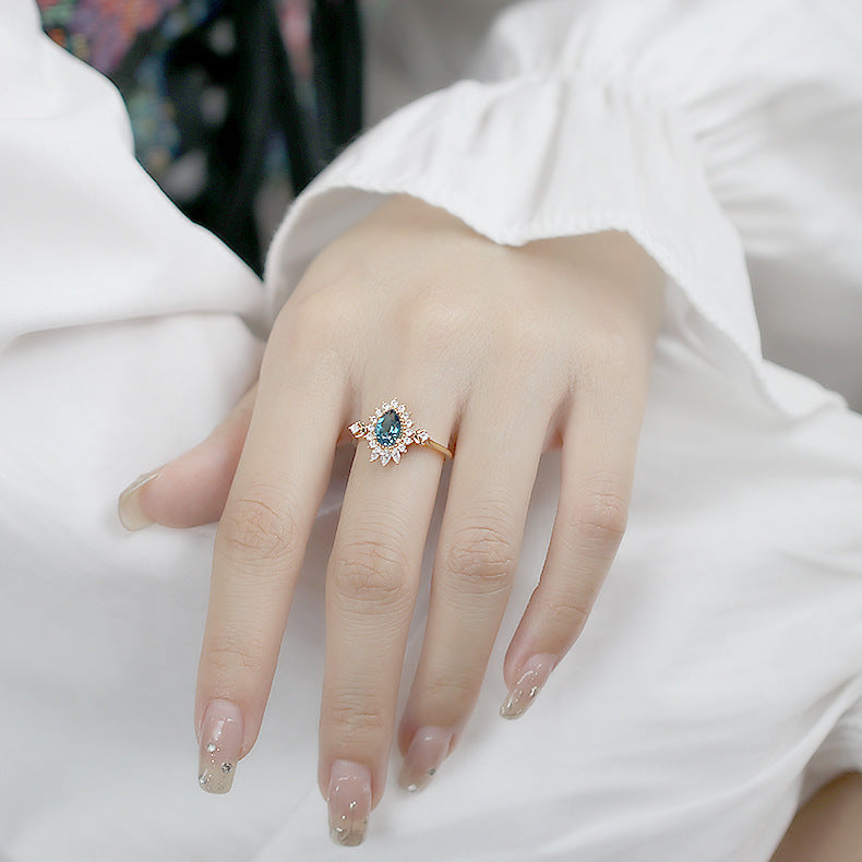 Lunar Halo Blue Topaz Ring